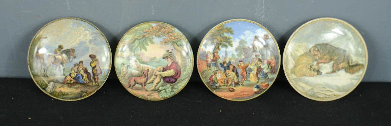 A group of four Prattware pot lids.