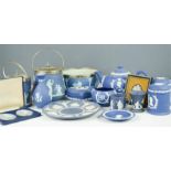 A quantity of Wedgwood jasperware, dark blue including tea pot, fruit bowl, jars and bud vase.