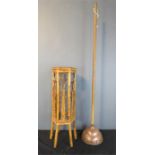 A bamboo stand 67cm high and a copper dolly.