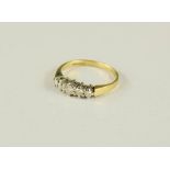 An 18ct gold and diamond ring, set with five graduated diamonds, size I, 2.5g.