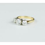A 9ct gold three stone paste ring, size L/M, 3.3g.