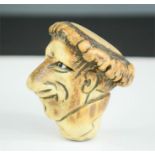 A 19th century horn cane top, carved in the form of a face inscribed J Harman, 56 Coleman Street,