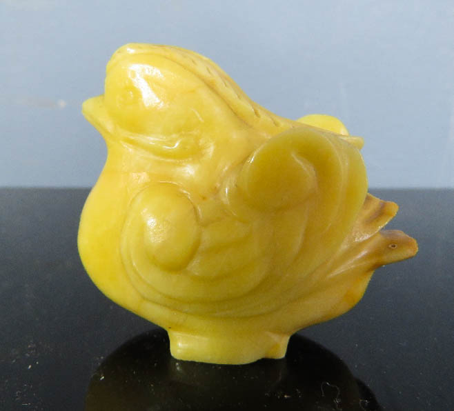 A 19th century rare Chinese yellow hardstone carved mandarin duck.