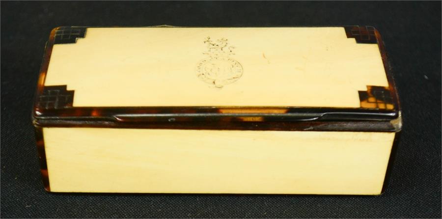 A 19th century tortoiseshell snuff box, with gold inlaid stringing, and crest engraved to the