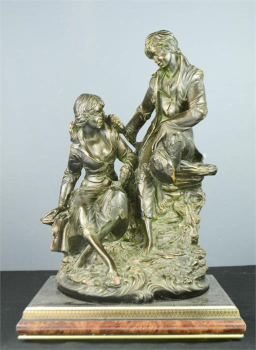 A bronzed figure group, raised on a plinth, 50 by 30cm.