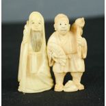 Two carved bone Chinese figures.