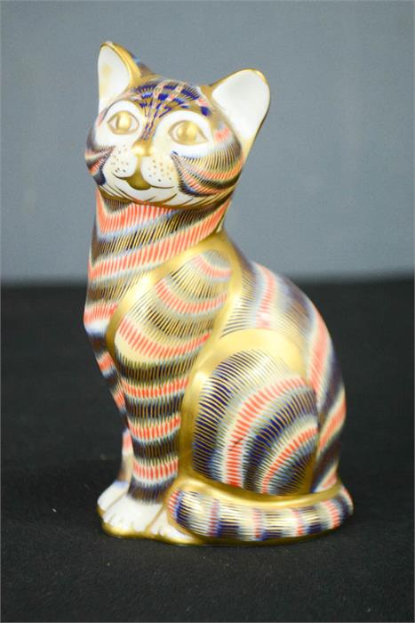 A Royal Crown Derby bone china cat, LI 13cm high.