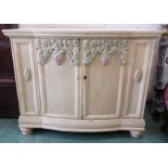 A large painted sideboard, French style, carved with decoration, 128cm wide by 61cm deep by 103cm