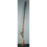 A musket with curved stock, 131cm long.