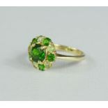 A 9ct gold and tourmaline ring, in pale and dark green, flowerhead, size N, 3.1g.