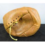 An antique leather football.