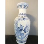 A large blue and white Japanese vase.