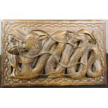 A Chinese hardwood box, depicting a relief carved dragon, 21 by 13cm.