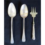 Two silver serving spoons and a silver plated fork