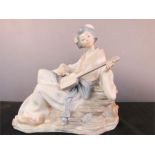 A Nao Lladro figure; Japanese woman playing lyre.
