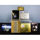 A group of vintage cigarette cases of differing style and form.