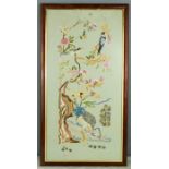 A Japanese embroidered panel, depicting birds and flowers.