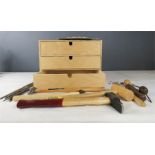 A small set of three drawers containing wooden tools, sandpaper and other jewellery making