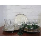 A collection of plated silver salvers, sugar castor, and ten greens stem glasses.