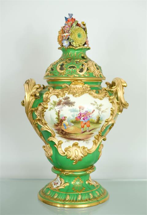 A French 19th century porcelain vase, with green ground and painted with floral groups, with gilt