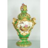 A French 19th century porcelain vase, with green ground and painted with floral groups, with gilt