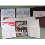 A group of American stamps, sets from '72-'77 and an album.