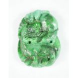 A spinach green jadeite carving / pendant, 6½ by 4½cm.