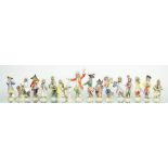 A late 19th century Fifteen Meissen Monkey-Band group of figures, including conductor and stand,