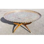 A large oval copper Islamic tray top table, 82 by 110cm.