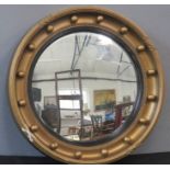 A porthole wall mirror, giltwood.