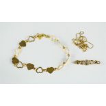A 9ct gold bracelet, brooch and necklace. 8.7g.