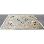 A Persian Heriz design green ground rug / wall hanging 230 by 160cm.