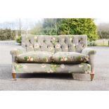 A mahogany framed button back settee, with curved front, upholstered in GP&J Baker Icelandic Poppies