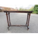 A mahogany Victorian chess table raised on barleytwist legs.