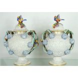 A fine and rare pair of Meissen snowball blossom lidded vases, 20th century, white glazed