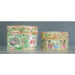 Two Chinese cylindrical boxes, 19th century, enamelled with figural scenes.