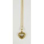An 18ct gold happy diamond Chopard heart pendant and chain, the glass fronted open heart