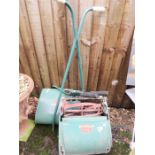 A Qualcast lawnmower, shears and gas stove.