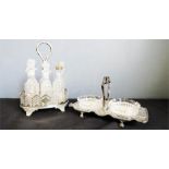 A silver plated cruet set and a condiment stand with two glass dishes.