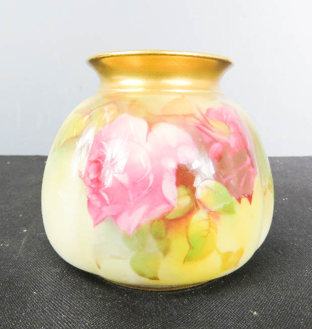 A Royal Worcester vase, in the rose pattern.