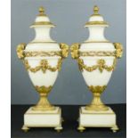 A pair of French ormolu marble urns, stamped Thomire a Paris, to the bases, with finely cast gilt