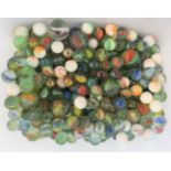 A collection of antique marbles, including chinas, dobbers and swirls.