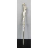 An Art Nouveau white metal letter opener with maiden handle, 22cm.