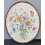 An embroidered panel, floral group, in an oval frame.