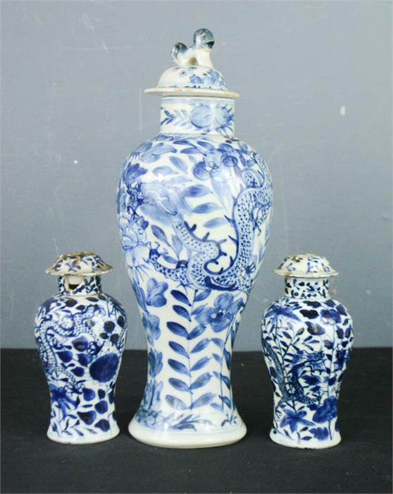 A pair of Chinese blue and white jars and covers 14cm, a blue and white vase depicting dragon and