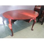 A 19th century red walnut Irish dropleaf dining table.