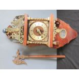 A brass bracket wall clock, together with a metal and treen Indian axe.