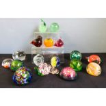 A quantity of glass paperweights including two Wedgwood birds, Millefiori example, grapes, tangerine