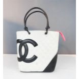 A black and white Chanel bag.