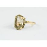 A 9ct gold and citrine oval ring, size L, 3g.